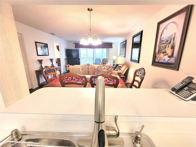 6507 Stone River Rd Unit 302, Bradenton, FL 34203 - dining space featuring a chandelier