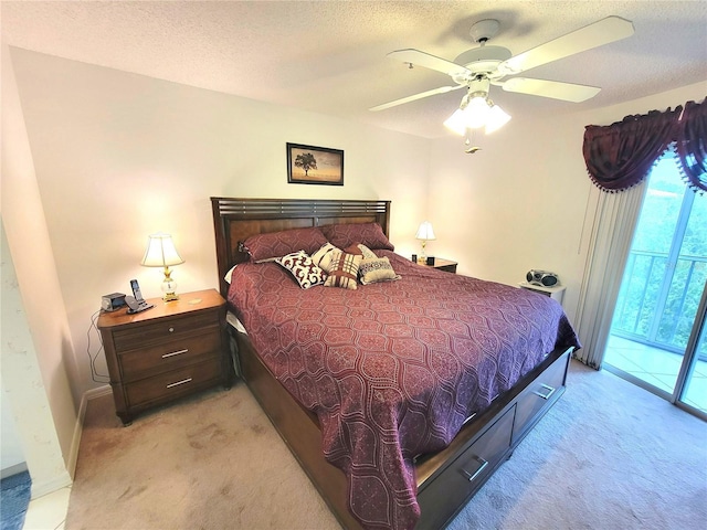 6507 Stone River Rd Unit 302, Bradenton, FL 34203 - bedroom featuring light colored carpet, access to outside, ceiling fan, and a textured ceiling