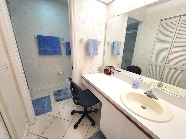 6507 Stone River Rd Unit 302, Bradenton, FL 34203 - full bathroom with tile patterned flooring, vanity, wallpapered walls, a shower with shower door, and a closet