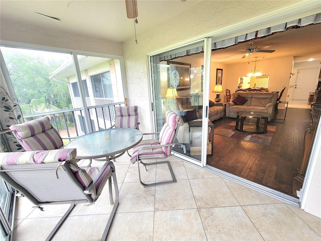 6507 Stone River Rd Unit 302, Bradenton, FL 34203 - sunroom / solarium featuring ceiling fan and an outdoor hangout area