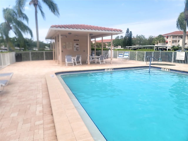 6507 Stone River Rd Unit 302, Bradenton, FL 34203 - community pool with a patio area