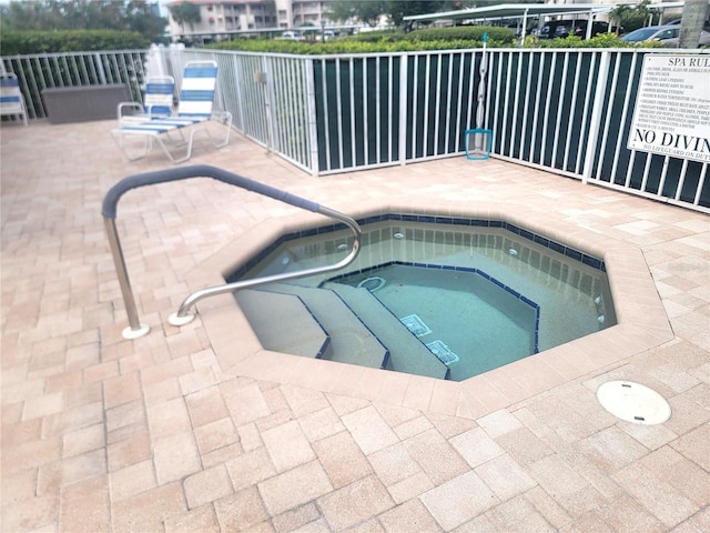 6507 Stone River Rd Unit 302, Bradenton, FL 34203 - view of pool featuring a community hot tub and a patio