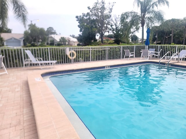 6507 Stone River Rd Unit 302, Bradenton, FL 34203 - community pool featuring a patio
