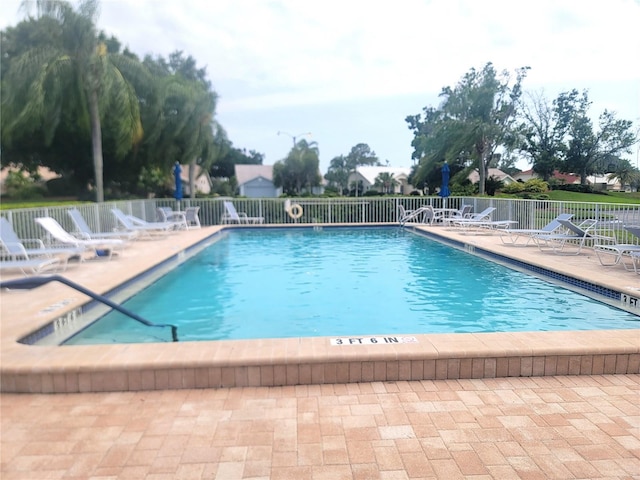 6507 Stone River Rd Unit 302, Bradenton, FL 34203 - community pool featuring a patio
