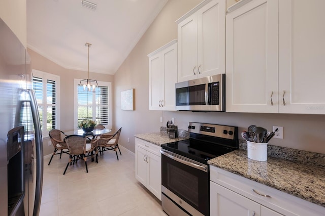 13714 Messina Loop Unit 202, Bradenton, FL 34211 - kitchen with stainless steel appliances, lofted ceiling, white cabinets, crown molding, and light stone countertops