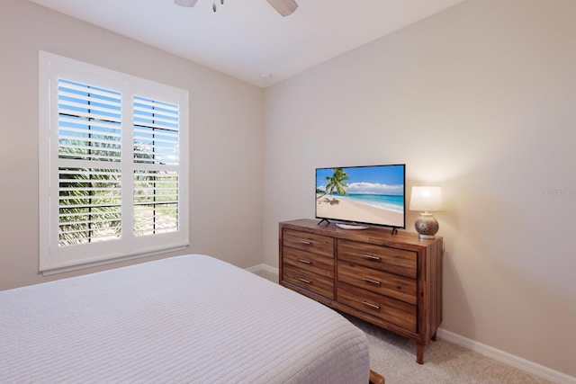 13714 Messina Loop Unit 202, Bradenton, FL 34211 - bedroom featuring multiple windows, light colored carpet, and ceiling fan