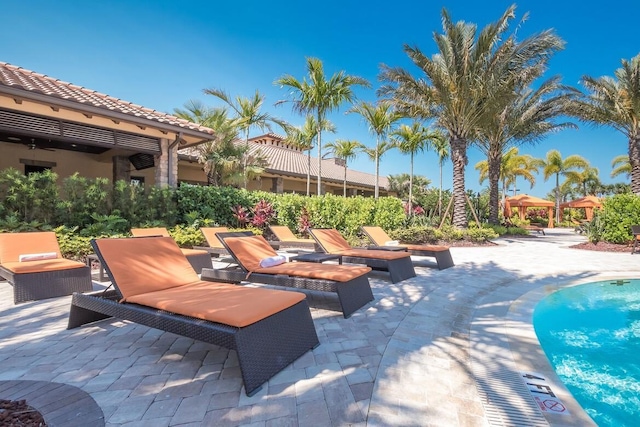 13714 Messina Loop Unit 202, Bradenton, FL 34211 - outdoor pool featuring a patio area and an outdoor fire pit
