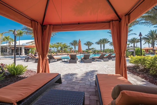 13714 Messina Loop Unit 202, Bradenton, FL 34211 - view of patio featuring a gazebo and a community pool