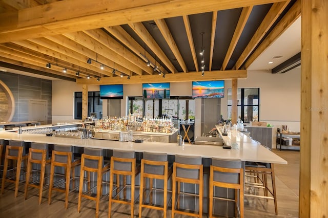 13714 Messina Loop Unit 202, Bradenton, FL 34211 - kitchen featuring open floor plan, a kitchen bar, and rail lighting