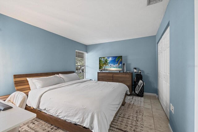 3003 Quail Holw Unit 10, Sarasota, FL 34235 - bedroom featuring a closet and baseboards