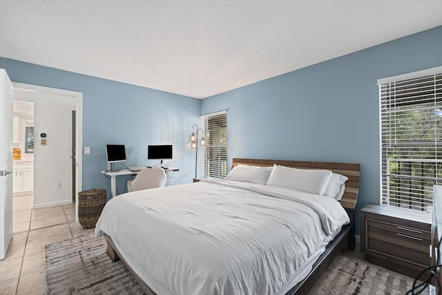 3003 Quail Holw Unit 10, Sarasota, FL 34235 - bedroom featuring light tile patterned floors and baseboards