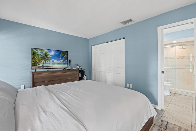 3003 Quail Holw Unit 10, Sarasota, FL 34235 - bedroom with light tile patterned floors, a closet, and ensuite bathroom