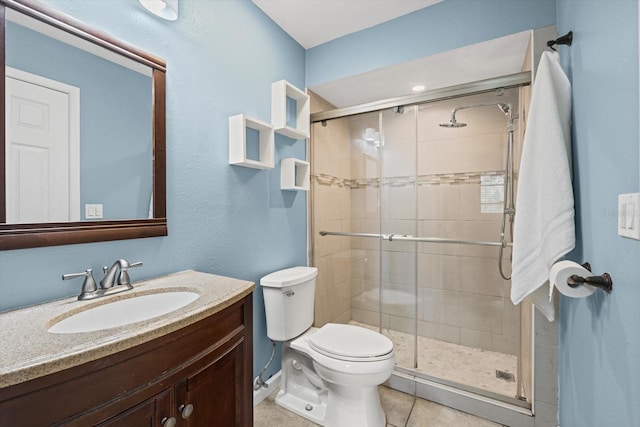 3003 Quail Holw Unit 10, Sarasota, FL 34235 - bathroom featuring a shower stall, vanity, and tile patterned floors