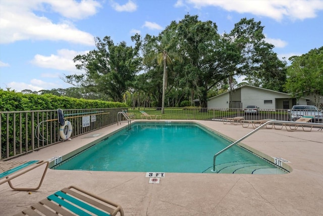 3003 Quail Holw Unit 10, Sarasota, FL 34235 - community pool with a patio and view of scattered trees