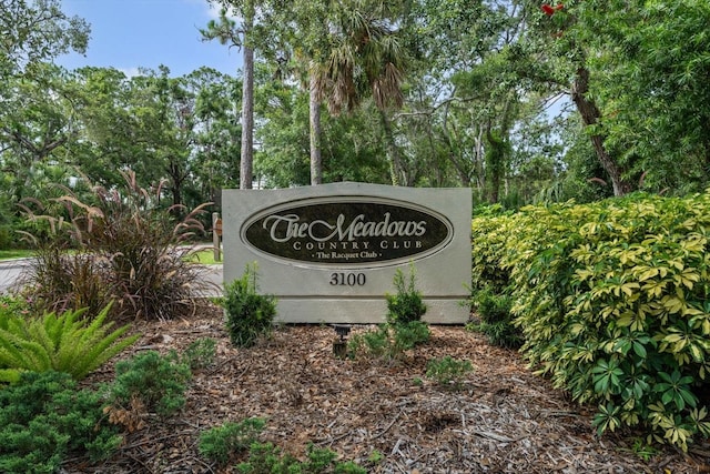 3003 Quail Holw Unit 10, Sarasota, FL 34235 - community sign with view of scattered trees