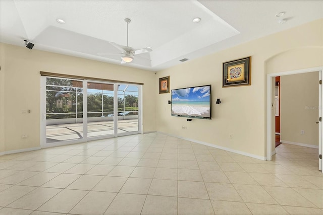 7005 Goldrush Ln, Bradenton, FL 34201 - empty room featuring a ceiling fan, a raised ceiling, light tile patterned floors, and recessed lighting