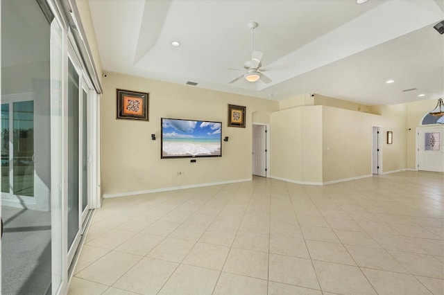 7005 Goldrush Ln, Bradenton, FL 34201 - unfurnished living room featuring light tile patterned floors, ceiling fan, a raised ceiling, and recessed lighting