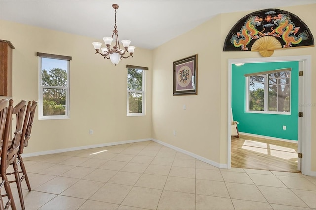7005 Goldrush Ln, Bradenton, FL 34201 - unfurnished dining area featuring a chandelier, healthy amount of natural light, and light tile patterned flooring