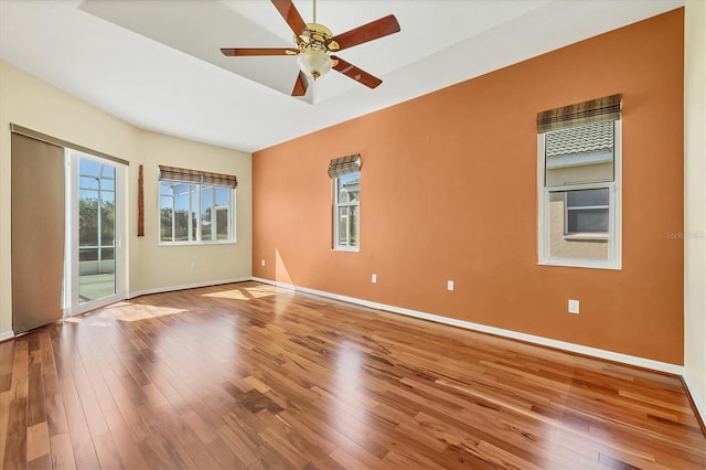 7005 Goldrush Ln, Bradenton, FL 34201 - empty room with hardwood / wood-style floors and a ceiling fan
