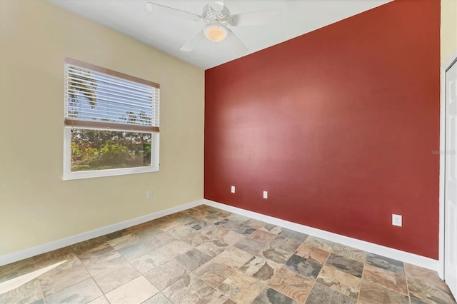 7005 Goldrush Ln, Bradenton, FL 34201 - empty room featuring stone finish flooring and ceiling fan