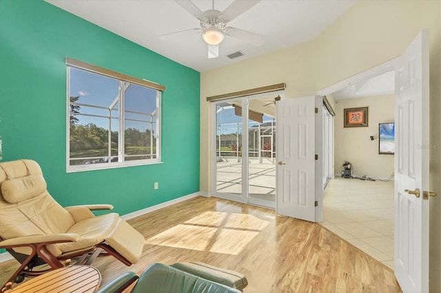 7005 Goldrush Ln, Bradenton, FL 34201 - living area featuring a ceiling fan and light wood-style flooring