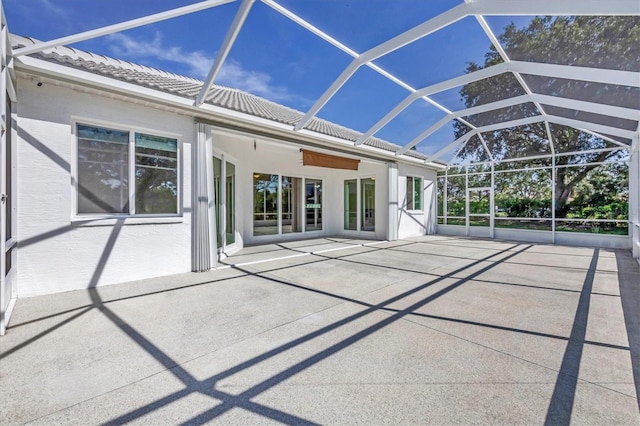 7005 Goldrush Ln, Bradenton, FL 34201 - rear view of house featuring a patio area, glass enclosure, and a tiled roof