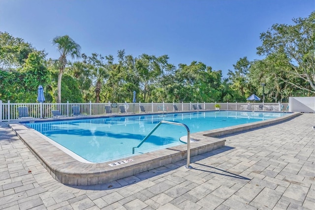 7005 Goldrush Ln, Bradenton, FL 34201 - community pool featuring view of wooded area and a patio area