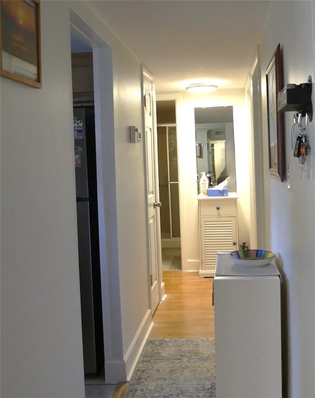 1850 Sunny Dr Unit F4, Bradenton, FL 34207 - corridor with light wood-style floors and baseboards