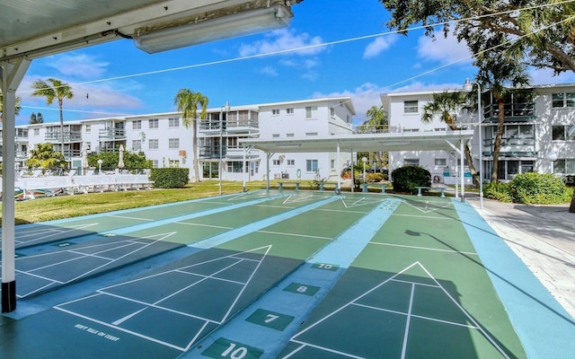 1850 Sunny Dr Unit F4, Bradenton, FL 34207 - surrounding community featuring shuffleboard and a yard