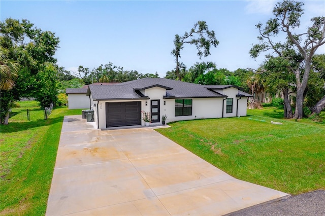 326 Randolph Rd, Venice, FL 34293 - view of front facade featuring concrete driveway, an attached garage, stucco siding, a front lawn, and roof with shingles