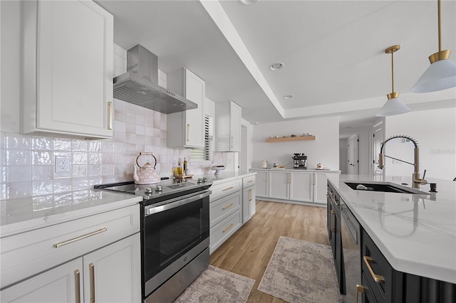326 Randolph Rd, Venice, FL 34293 - kitchen featuring stainless steel range with electric stovetop, wall chimney exhaust hood, open shelves, white cabinets, and decorative backsplash