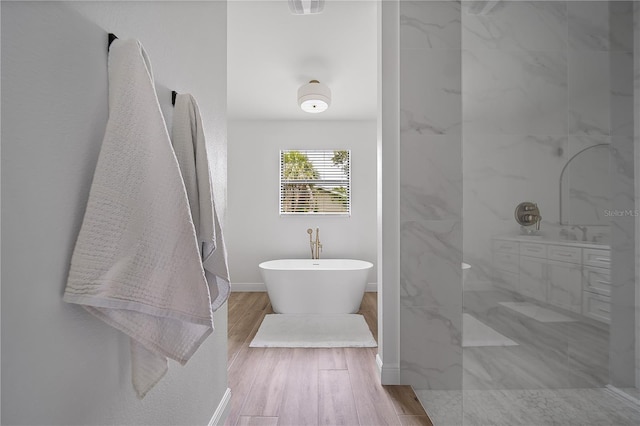 326 Randolph Rd, Venice, FL 34293 - full bath featuring a freestanding tub, walk in shower, and wood finished floors