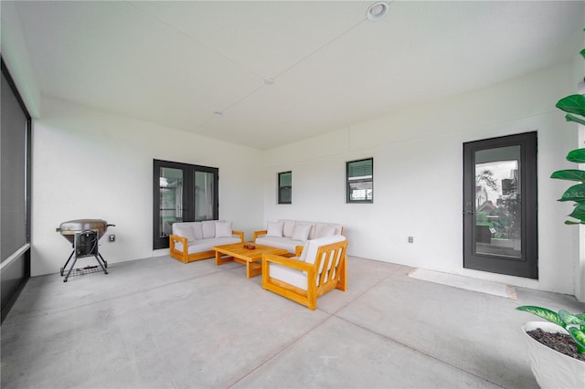 326 Randolph Rd, Venice, FL 34293 - living room with concrete flooring and french doors