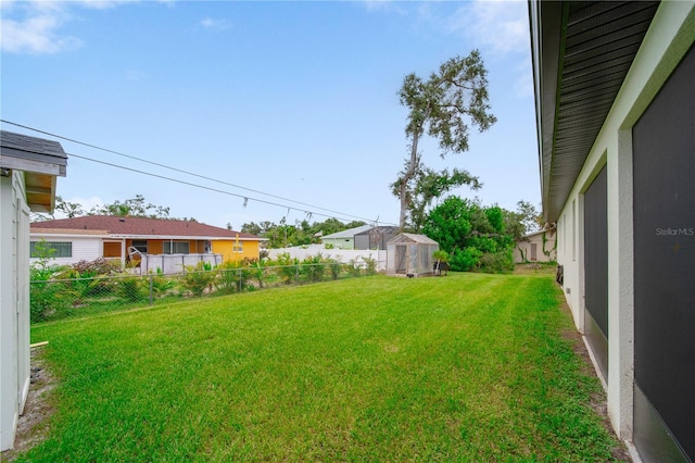 326 Randolph Rd, Venice, FL 34293 - fenced yard featuring a greenhouse and an outbuilding