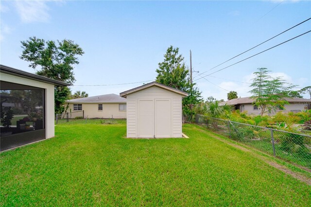 326 Randolph Rd, Venice, FL 34293 - fenced backyard featuring a storage unit