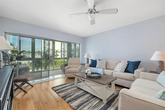 2110 Benjamin Franklin Dr Unit 301, Sarasota, FL 34236 - living room with wood finished floors and a ceiling fan