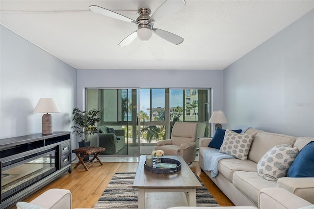 2110 Benjamin Franklin Dr Unit 301, Sarasota, FL 34236 - living room featuring wood finished floors and a ceiling fan