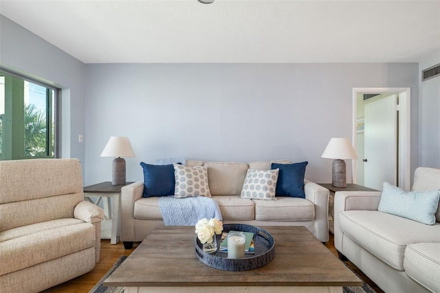 2110 Benjamin Franklin Dr Unit 301, Sarasota, FL 34236 - living area with wood finished floors