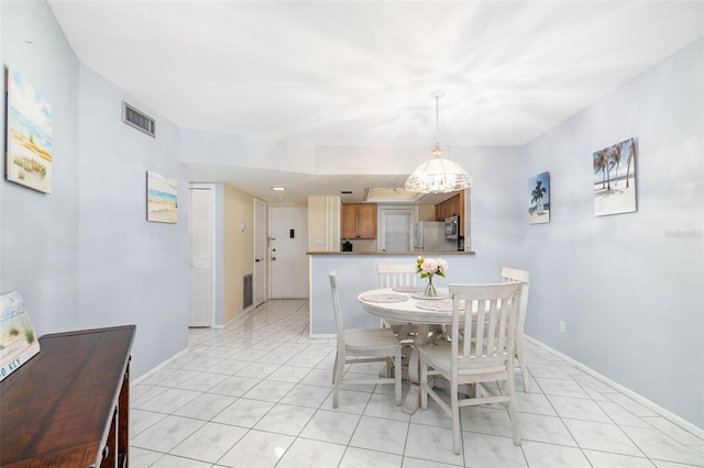 2110 Benjamin Franklin Dr Unit 301, Sarasota, FL 34236 - dining space featuring light tile patterned floors