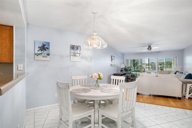 2110 Benjamin Franklin Dr Unit 301, Sarasota, FL 34236 - dining area featuring a ceiling fan