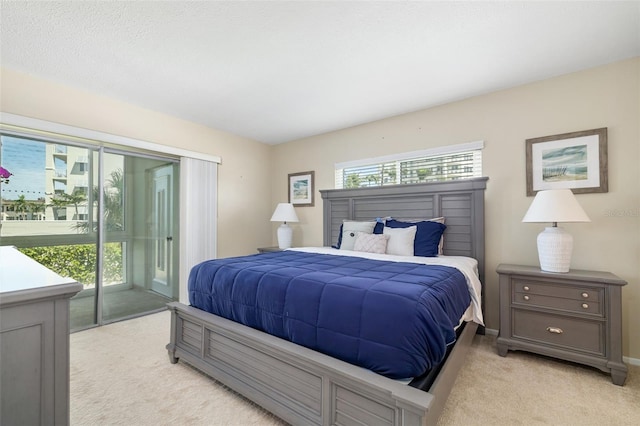 2110 Benjamin Franklin Dr Unit 301, Sarasota, FL 34236 - bedroom featuring light colored carpet and access to outside