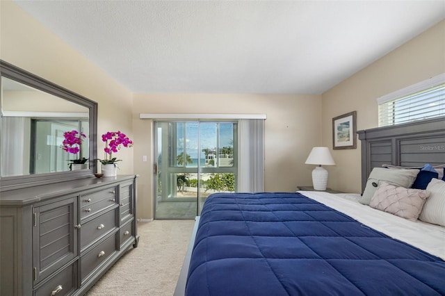 2110 Benjamin Franklin Dr Unit 301, Sarasota, FL 34236 - bedroom with light colored carpet and access to exterior