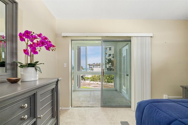 2110 Benjamin Franklin Dr Unit 301, Sarasota, FL 34236 - bedroom featuring light colored carpet and access to exterior