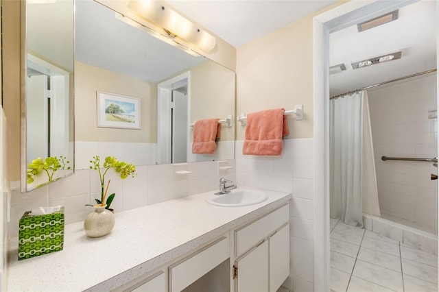 2110 Benjamin Franklin Dr Unit 301, Sarasota, FL 34236 - full bath featuring vanity, tiled shower, marble look tiles, tile walls, and a wainscoted wall