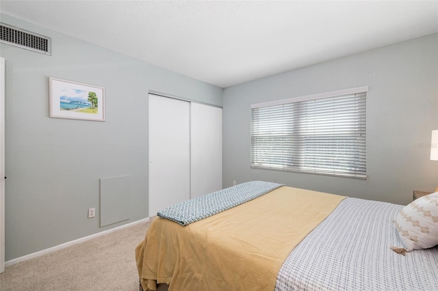 2110 Benjamin Franklin Dr Unit 301, Sarasota, FL 34236 - bedroom with a closet and carpet flooring