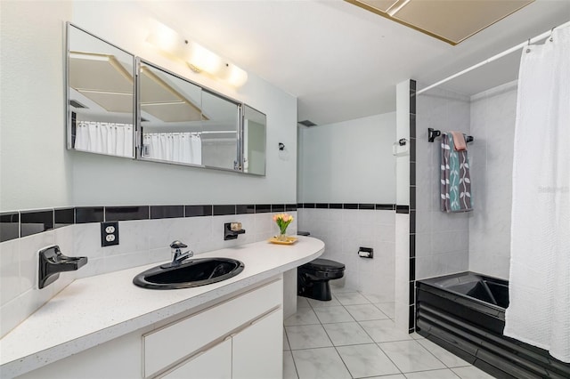2110 Benjamin Franklin Dr Unit 301, Sarasota, FL 34236 - bathroom featuring vanity, shower / bath combo, and tile walls