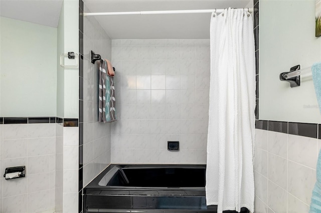 2110 Benjamin Franklin Dr Unit 301, Sarasota, FL 34236 - bathroom with tile walls and shower / tub combo