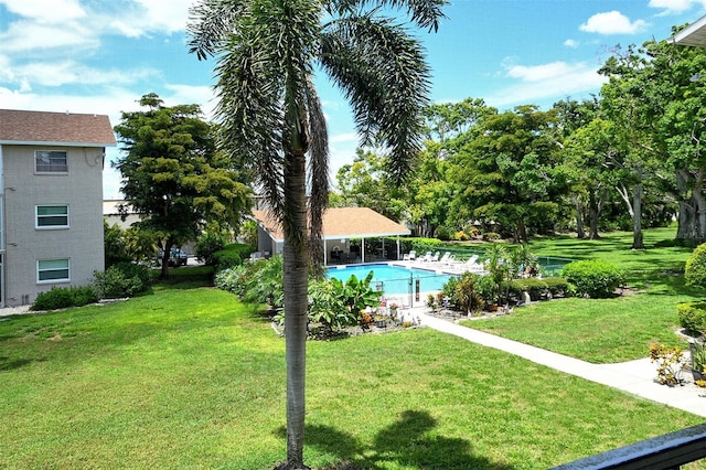 3985 Maceachen Blvd Unit 224, Sarasota, FL 34233 - view of green lawn featuring a community pool