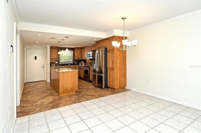 3985 Maceachen Blvd Unit 224, Sarasota, FL 34233 - kitchen with a chandelier, stainless steel appliances, crown molding, brown cabinets, and a kitchen island