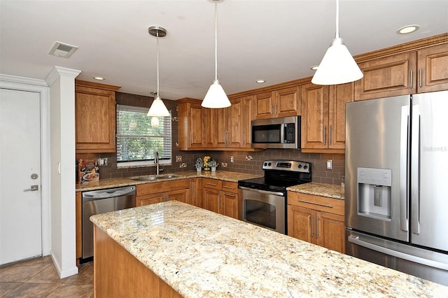 3985 Maceachen Blvd Unit 224, Sarasota, FL 34233 - kitchen with appliances with stainless steel finishes, brown cabinetry, backsplash, light stone countertops, and recessed lighting